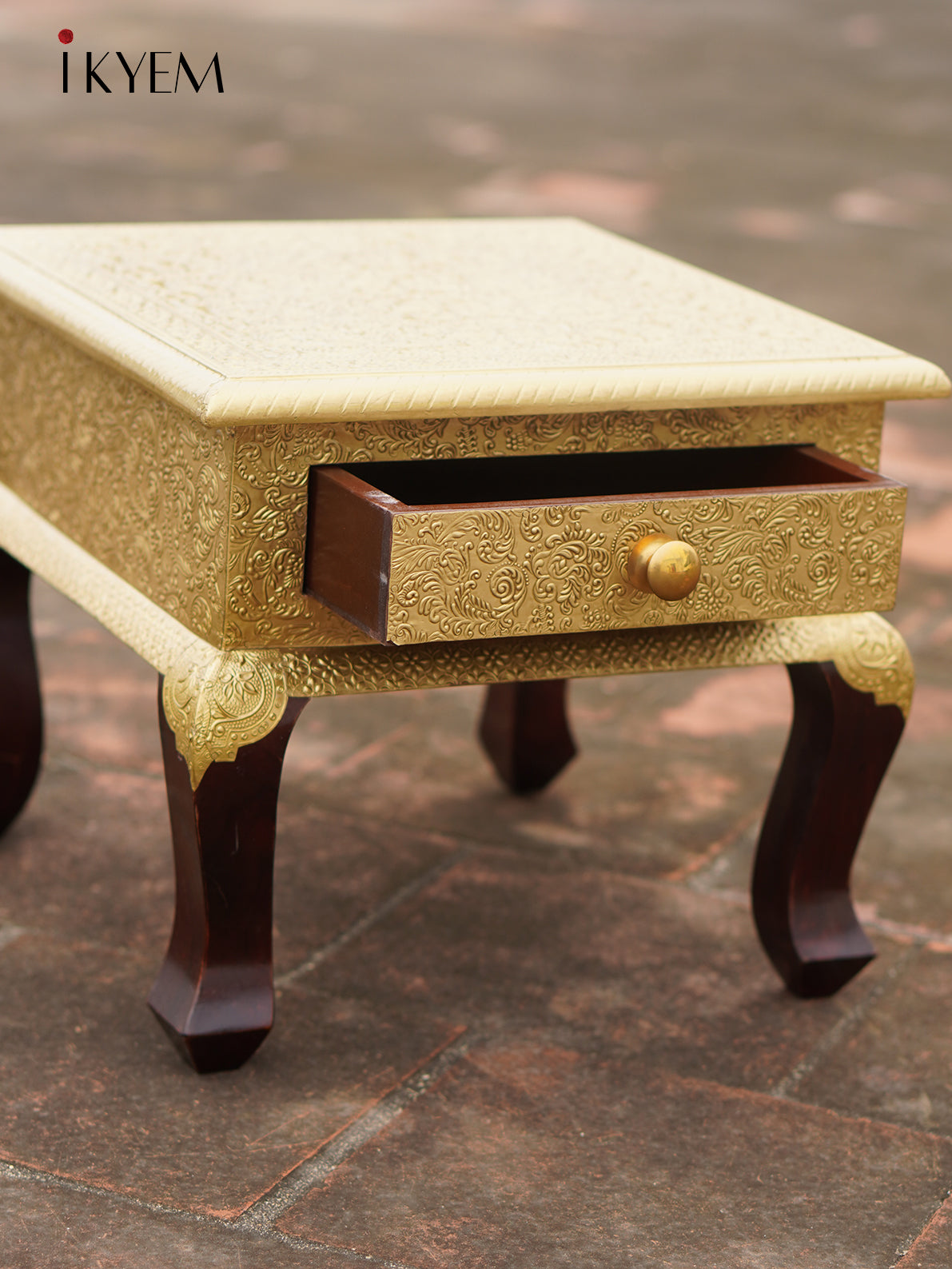 Brass Embellised table with drawer